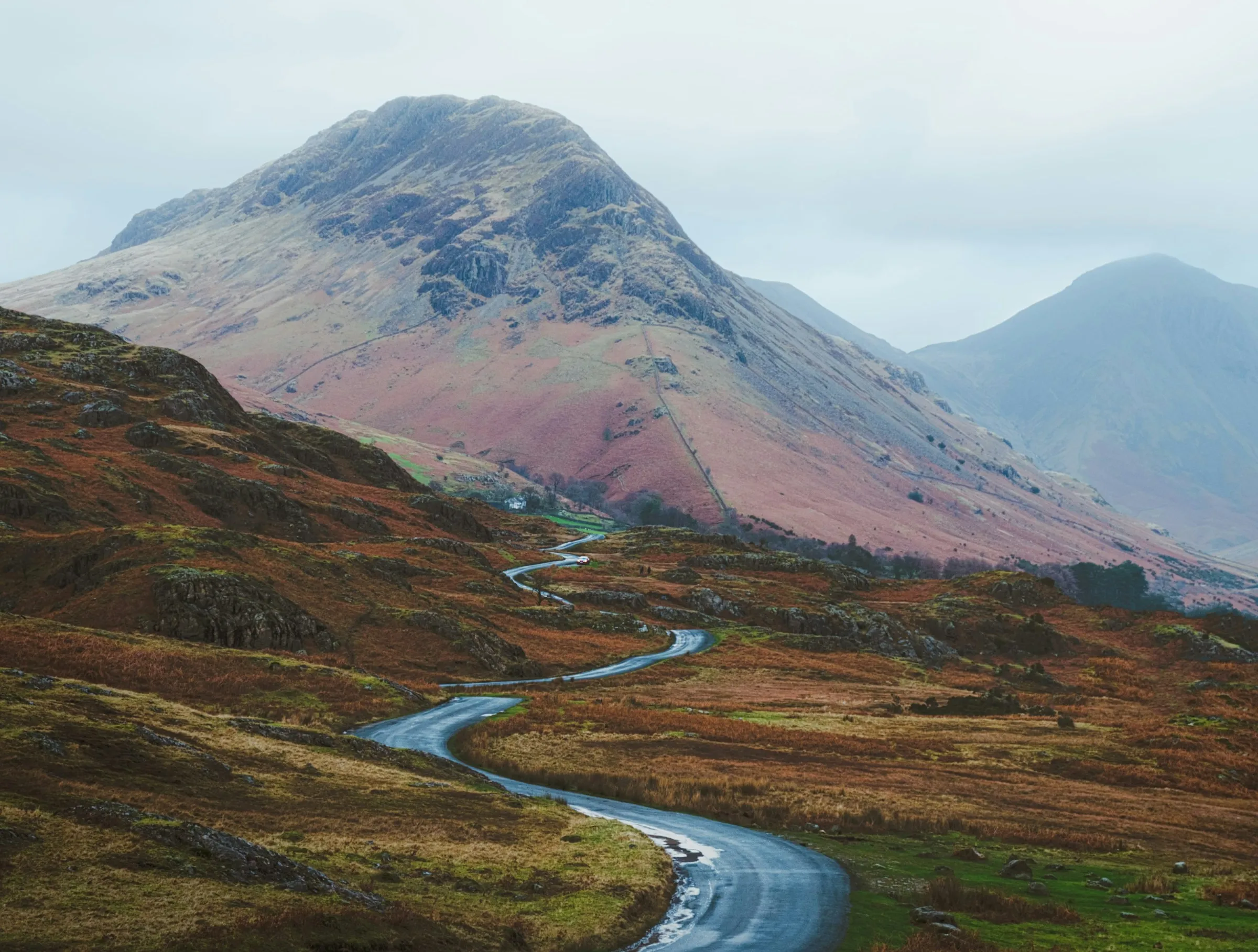A road winding through the Lake District fells